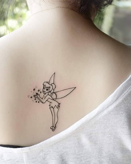Tinker Bell tattoo on the inner forearm
